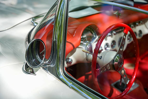Red vintage American car speeding along the Malecon in Havana, Cuba, motion blur, 50 megapixel image.