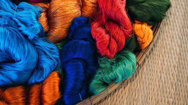 istock Natural colorful silk threads and dyeing with raw materials, traditional Thai sericulture in the countryside. 2215178436