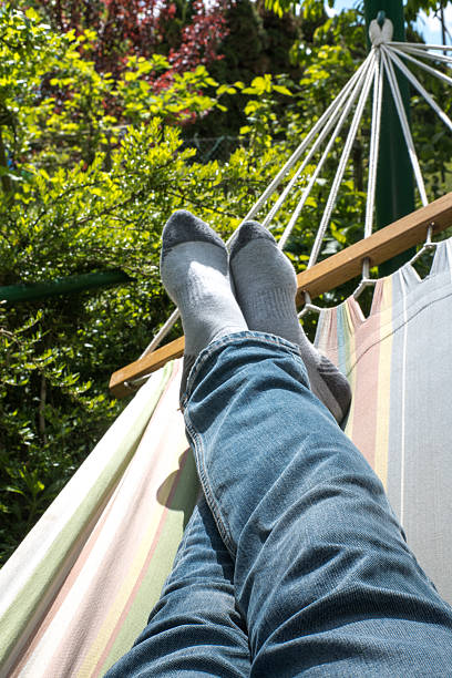 istock Relaxing in a hammock in the garden. 2215179435