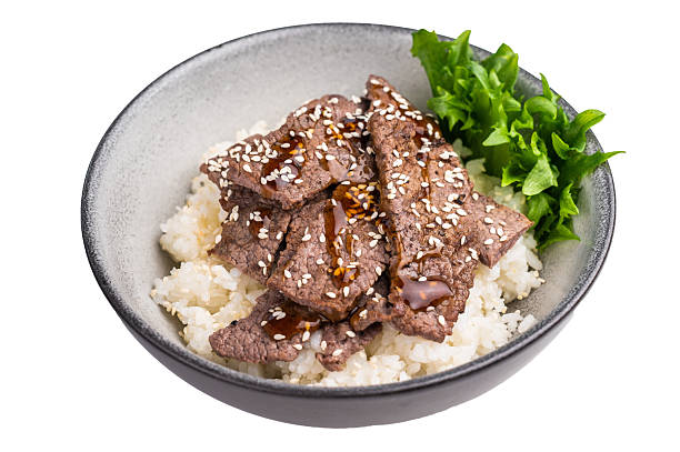 Delectable yakiniku feast, featuring a variety of marbled beef cuts and rice. A culinary journey that captures the essence of Japanese grilling traditions. isolated on white background. top view