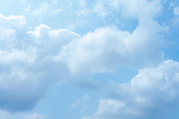 istock Serene Blue Sky with Fluffy Cumulus Clouds Peaceful Summer Day Background 2215183876