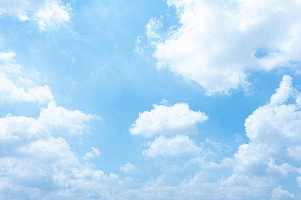 istock Serene Blue Sky with Fluffy White Clouds Heavenly Summer Day Background 2215184071