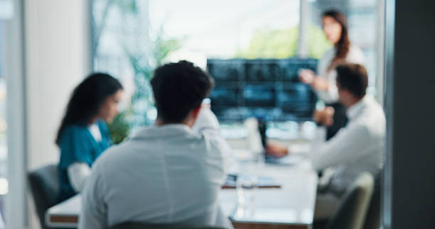 istock Doctor, meeting or discussion with presentation for collaboration or sharing ideas in boardroom. People, medical workers or healthcare employees with screen or team for question at hospital or clinic 2215185351