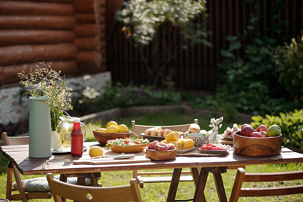 istock Outdoor Table Setting with Fresh Fruits and Flowers 2215185978