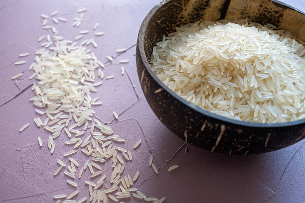 istock Rice grains in coconut bowl 2215187875