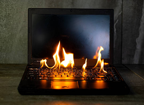 istock The computer laptop is burning with flames 2215189361