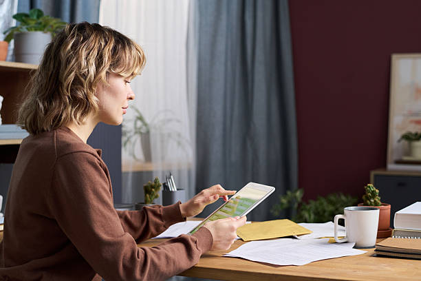 istock Woman Using Banking App on Digital Tablet 2215198915
