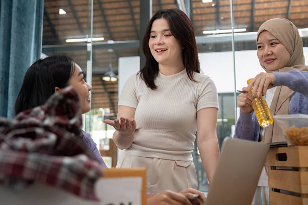 istock Community Support and Donation Drives. Engaged volunteers sharing ideas while preparing a charity event. 2215202085