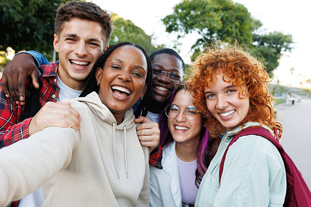 istock Happy diverse students taking a selfie together outdoors 2215207766