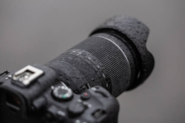 istock DSLR Camera with Telephoto Lens in Rain 2215208574