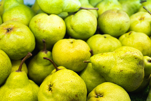 istock Fresh green pears sold in supermarket. 2215208704