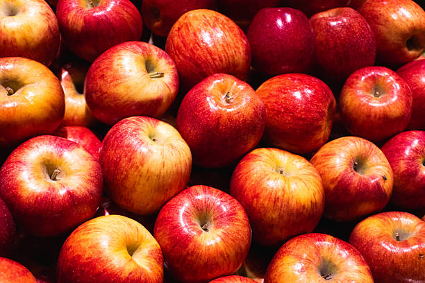 istock A background and close-up of fresh, shiny red apples 2215209088