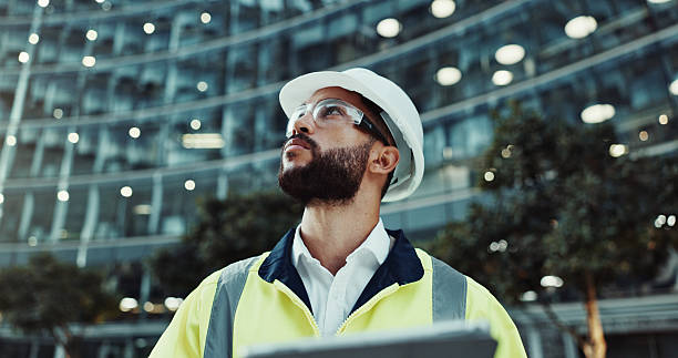 istock Tablet, engineer thinking and man in city for construction, planning and low angle at dawn. Technology, building and architect outdoor for maintenance decision, safety inspection or problem solving 2215212179