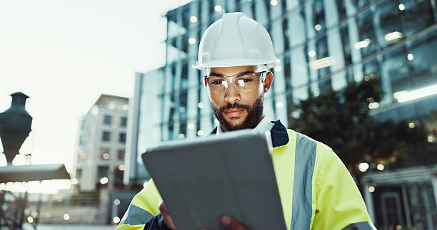 istock Tablet, civil engineer and man in city for construction, development and planning at dawn. Technology, building and architect outdoor for maintenance, safety inspection and infrastructure project 2215212182
