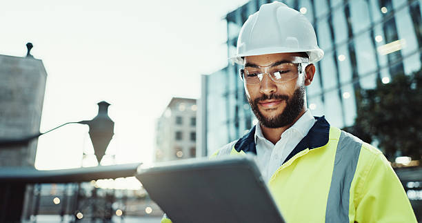 istock Tablet, architect and happy man in city for construction, development and planning at dawn. Technology, building and engineer outdoor for maintenance, safety inspection and infrastructure project 2215212185