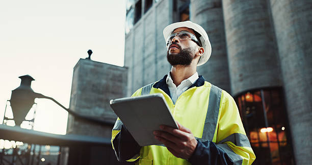 istock Tablet, architect planning and man outdoor for construction, thinking and low angle at dawn. Technology, building and engineer in city for maintenance decision, safety inspection or problem solving 2215212189