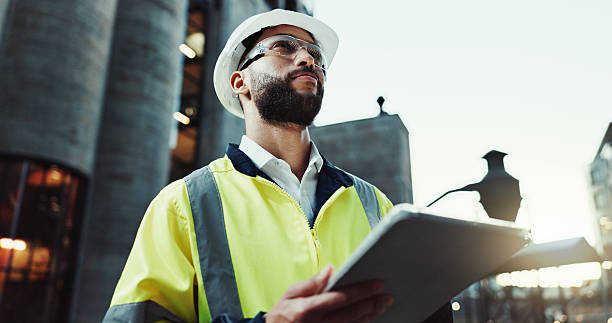 istock Tablet, engineer thinking and man outdoor for construction, planning and development at dawn. Technology, building and architect in city for maintenance decision, safety inspection or problem solving 2215212190