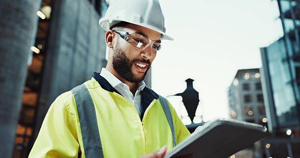 istock Tablet, civil engineer and happy man outdoor for construction, development or planning at dawn. Technology, building and architect in city for maintenance, safety inspection or industrial project 2215212193