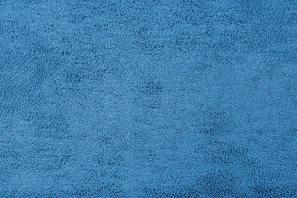 istock Structure of blue suede fabric with abstract shabby texture with shades closeup, macro. 2215213238