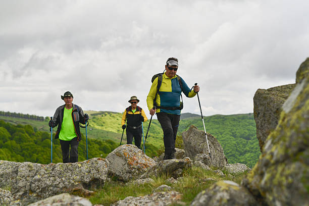 istock Outdoor Lovers Moving Up Scenic Path Toward Mountain Viewpoint 2215223287