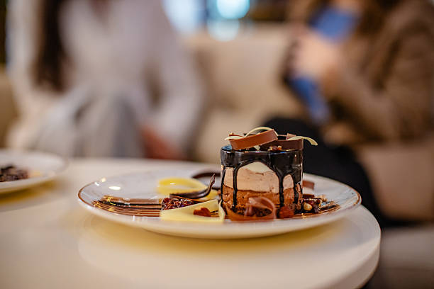 Tasty dessert with fruit garnish served in a refined hotel dining environment.