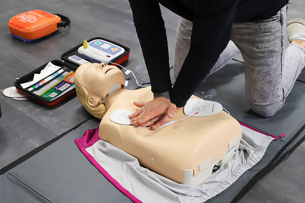 istock first aid course - company safety - cardiac massage - Basic Life Support 2215233076
