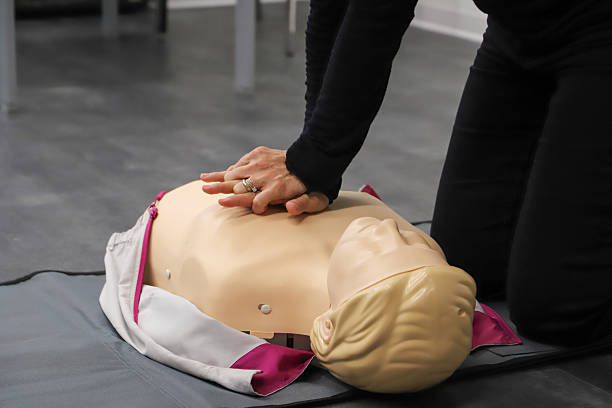 istock first aid course - company safety - cardiac massage - Basic Life Support 2215233175