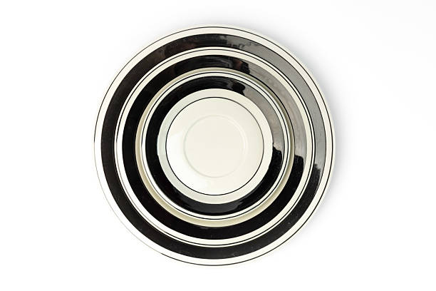 istock Empty restaurant dinner plate shot from above, isolated on white background. Classic elegant dish features a simple, yet stylish design, perfect for any table setting. 2215234389