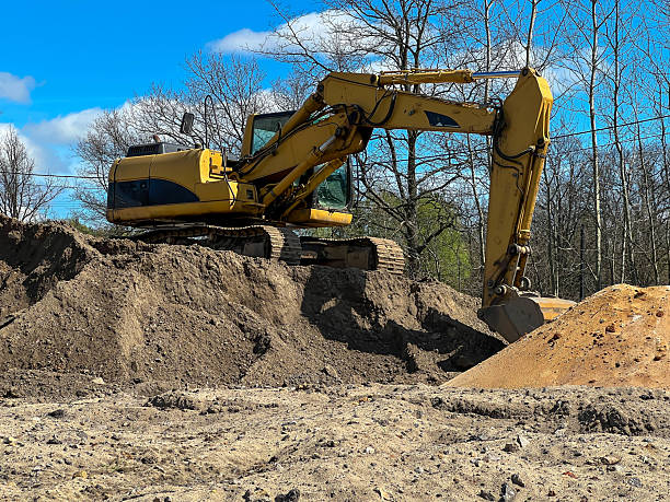 istock A large backhoe loader standing on a pile of earth 2215235387