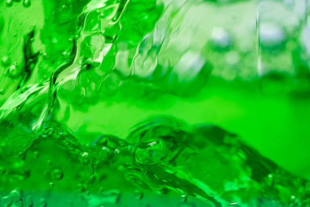 Water wave, close up of vibrant green liquid with bubbles, capturing dynamic movement and freshness. Perfect for backgrounds, beverages, or abstract concepts. soft drink