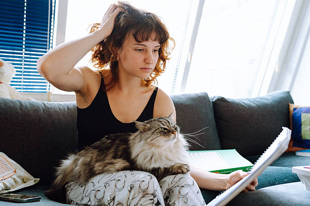 istock young woman spending time with her cat 2215236418