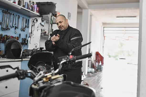 istock Rider Completing His Pre-Ride Ritual By Zipping Up His Black Motorcycle Jacket 2215236706
