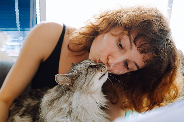 istock young woman spending time with her cat 2215237651