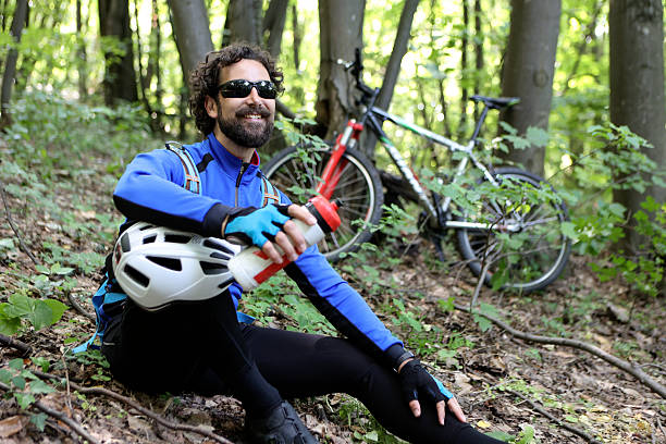 A man takes part in a 24-hour mountain bike race at night. The racers use battery-operated headlights mounted to their bicycle helmets and/or handlebars to ride the course through the night. (John Gibson Photo / Gibson Pictures)
