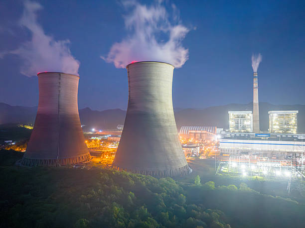 istock Thermal power plant night view, cooling tower 2215241715