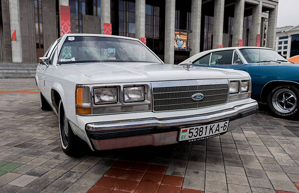 Buenos Aires, Argentina - Feb 25, 2024: Old blue shiny Ford Falcon Futura 1978 - 1982 vinyl roof sedan at a classic car show in a parking lot.