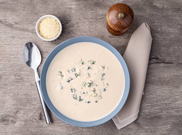 istock Cheese soup in a bowl over wooden table 2215242248