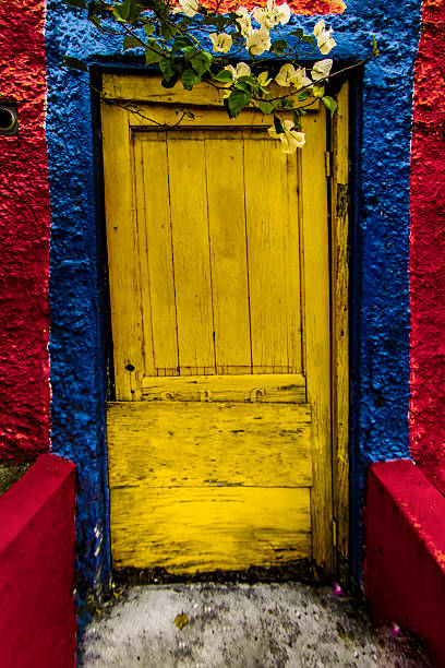 istock Yellow Door - Blue Trim - Red Wall 2215242266