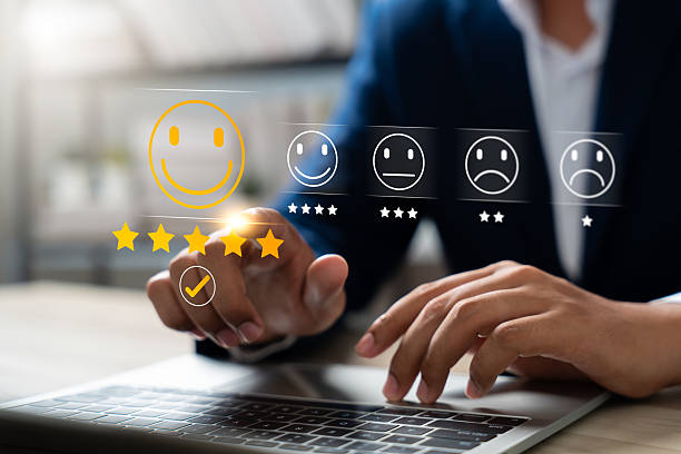 istock Customer using tablet give five star rating, Submit satisfaction survey through online application. Positive feedback highlight excellent service and product quality, improving brand reputation. 2215246279
