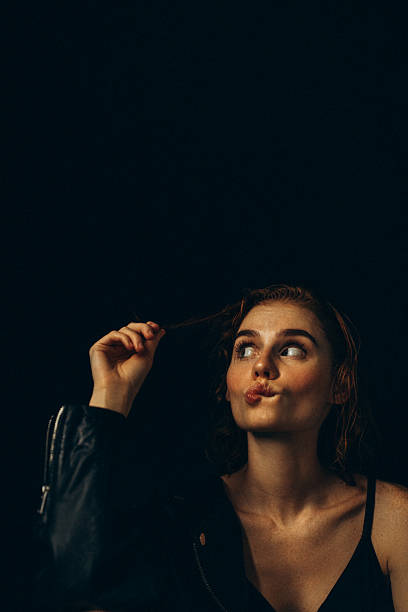 young beautiful girl on the street looking at the camera