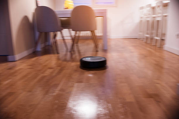 istock Robot vacuum cleaner in action 2215254054
