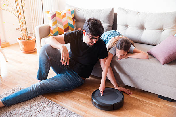 istock Let's turn on this robotic vacuum cleaner 2215255495