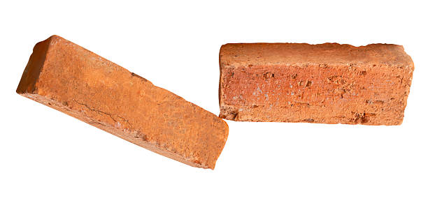 istock Side view of two cracked old red or orange bricks in stack isolated on white background with clipping path 2215257051