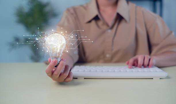 istock Hand of  holding illuminated light bulb, Idea innovation and inspiration concept.  creativity with bulbs that shine glitter, Concept for success. 2215258344