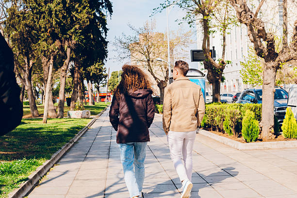 istock A couple walking through the city 2215258864