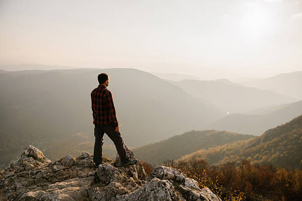 istock Man standing at the cliff with scenic view 2215259207