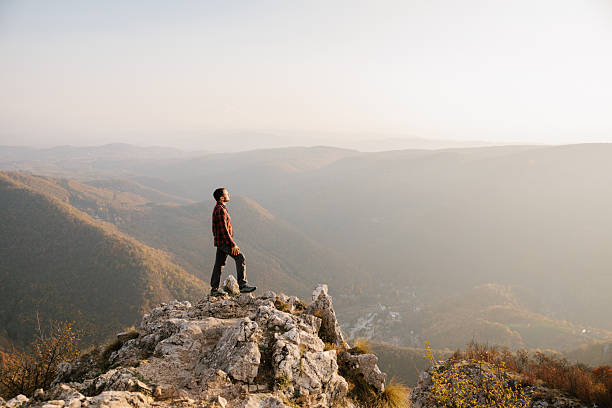 istock Man standing at the cliff with scenic view 2215259211