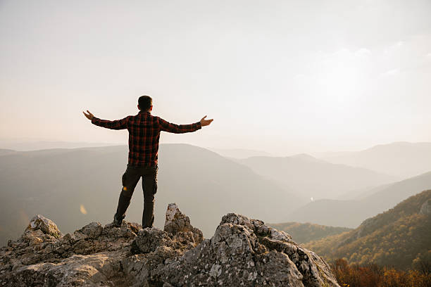 istock Man standing at the cliff with scenic view 2215259216