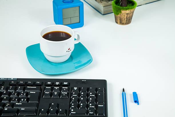 White office desk table with office supplies.
