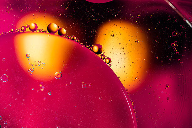 istock Colorful Oil Drops Bubbles and spheres. Flowing on Water Surface. Abstract background Macro Photography 2215262272